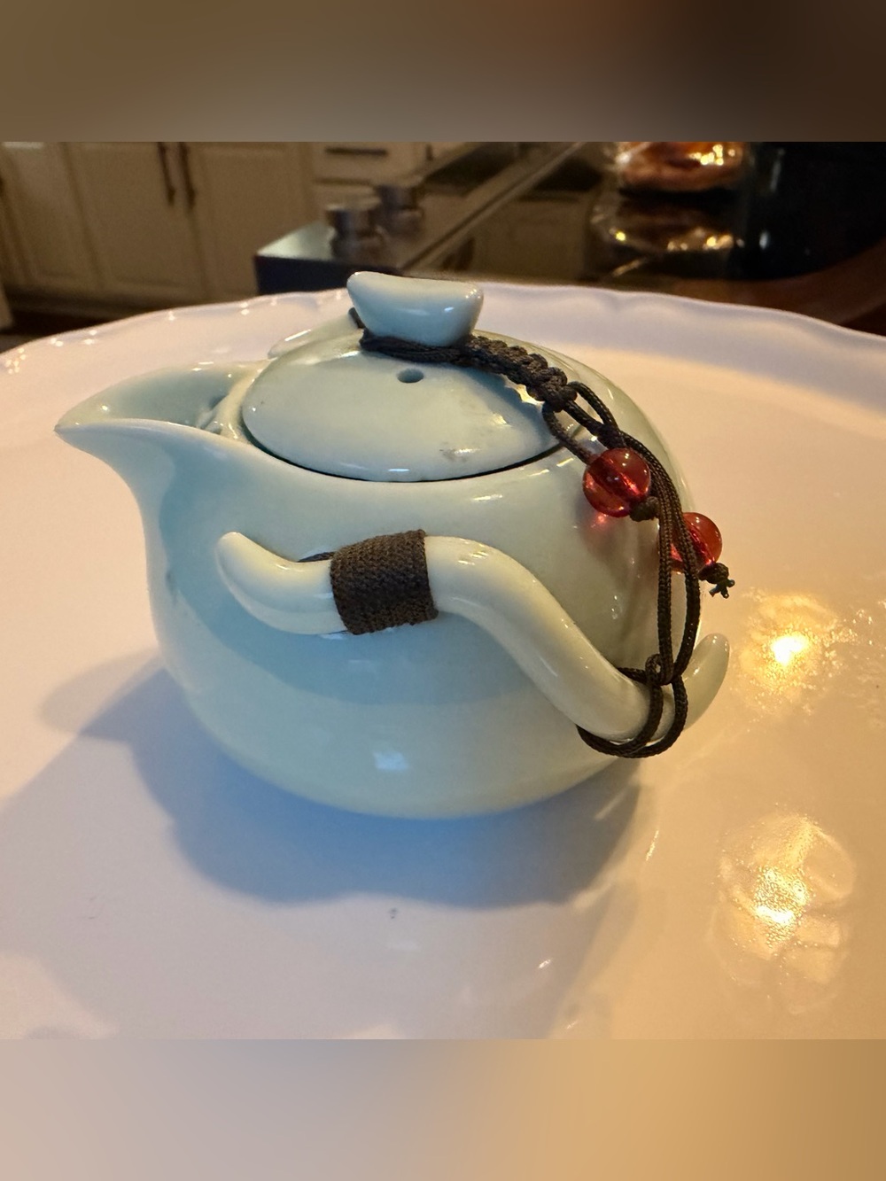 Ceramic Pale Green Mini Teapot with Integrates Strainer,Brown Cord and Red Beads